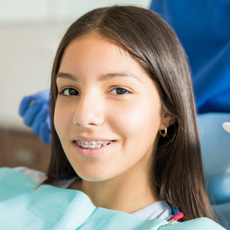 Teen girl with braces at dental office