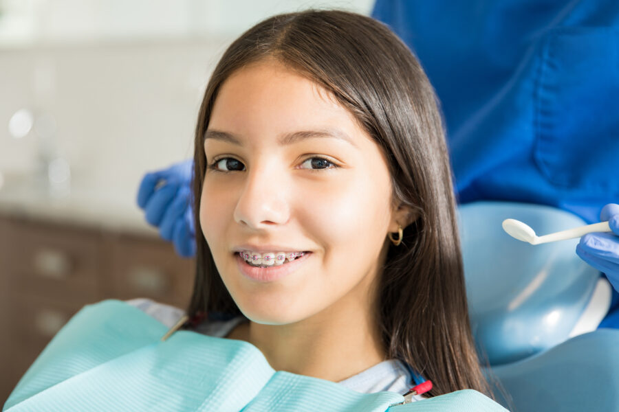 Teen girl with braces at dental office
