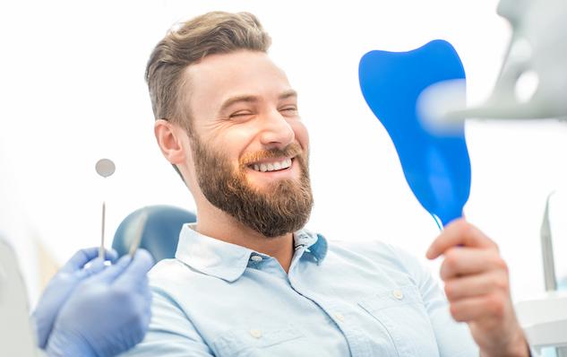 adult man smiling in an Orthodontics appointment