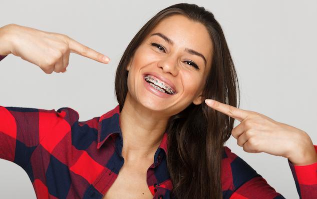 smiling women with braces.