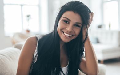 Smiling women after finishing her orthodontics treatment